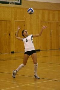 If you are serving the ball over to the other side, can you step on the outline while serving the ball?