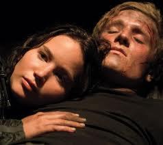 In catching fire what did peeta say to katniss that she couldnt quite catch before she dranged under by morphling