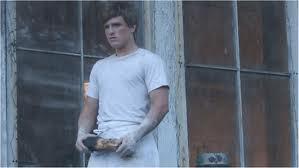 What month did Peeta give Katniss the bread?