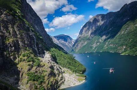 Which mountain range is known for its stunning fjords in Norway?