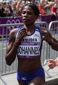 Who holds the Women's world record Marathon time as of 2020?