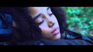 When Rue dies, what does Rue whisper to her, THE FIRST THING?