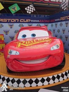 Which animated film features a character named Lightning McQueen, a race car?
