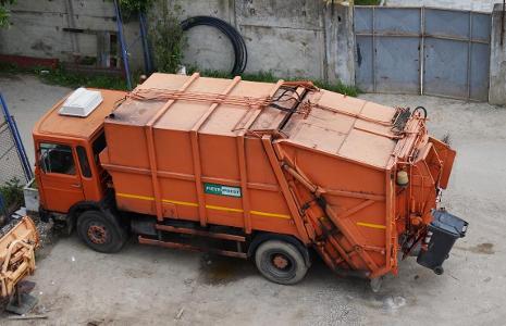 Which type of truck is used for carrying garbage and waste materials?