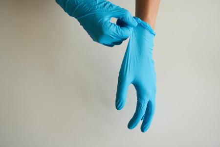 What is the primary purpose of disposable gloves?