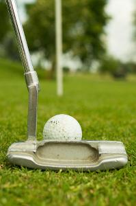Which game is played with a small white ball and a set of clubs?