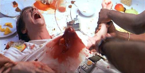 In the 70s movie, "Alien", who is the character in the film whose stomach is ripped open by a bloodthirsty alien in the classic scene?