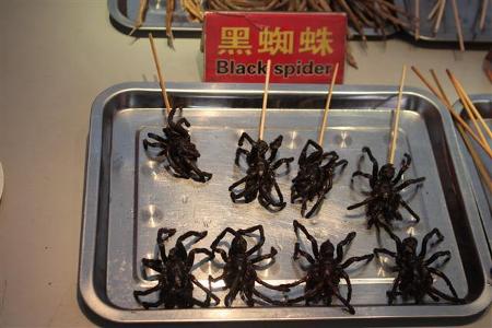 "Fried spider is a regional delicacy in Cambodia. In the Cambodian town of Skuon, the vending of fried spiders as a specialty snack is a popular attraction for tourists passing through this town." Wikipedia.  However, these are also consumed in China.