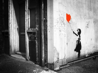 Which artist is known for creating the iconic 'Girl with a Balloon' piece?