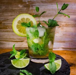 Which cocktail is made with rum, mint, sugar, and lime juice?