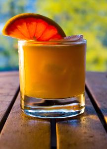 What is the main spirit used in a Whiskey Sour cocktail?
