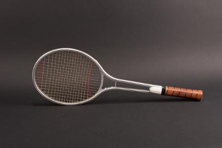 What material is used to make the strings of tennis rackets?