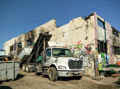 What type of truck is commonly used for transporting large quantities of construction waste or debris?