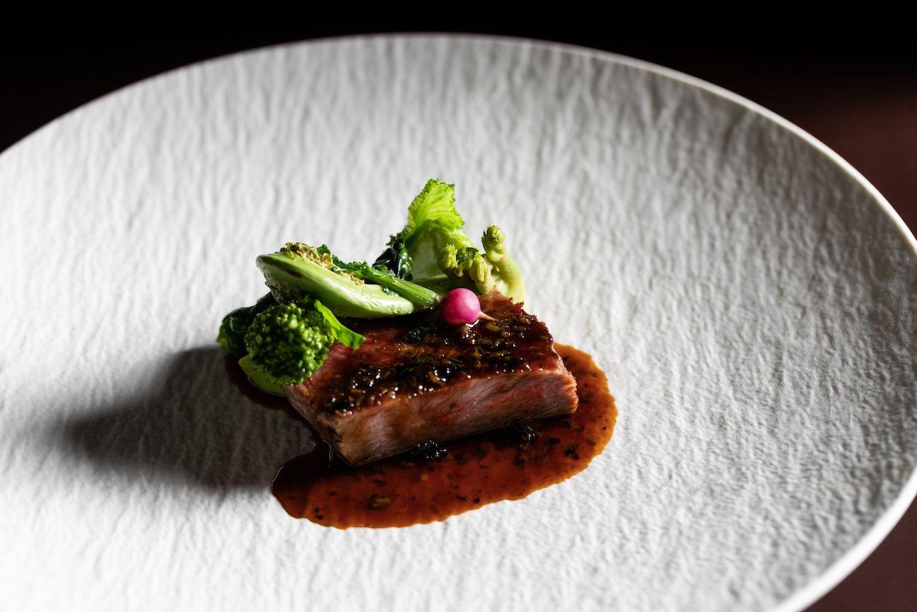 What is the purpose of a maitre d' in a fine dining restaurant?