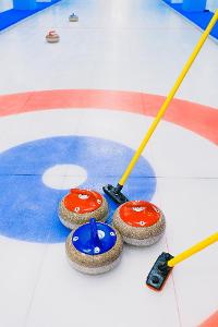 What is the name of the device used to deliver a curling stone?