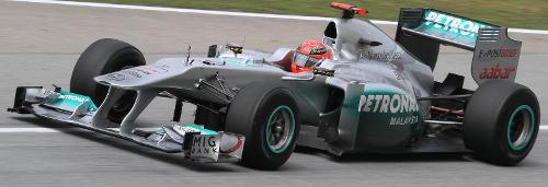 At which circuit did Michael Schumacher achieve his first Formula 1 victory?