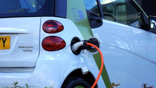 What is the approximate time required to fully charge an electric car using a standard charger?