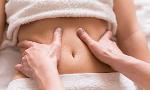What conditions or issues can holistic abdominal therapy help with?