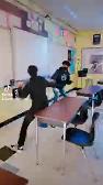 Two kids fighting in english with swords- I love this school