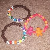 i made fall out boy ginasfs bracelets and a lesbian teddy bear bracelet!!