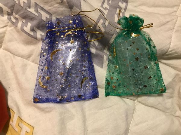 THE BAGS THE NECKLACES CAME IN ARE SO CUTE!! imma use mine to put herbs in