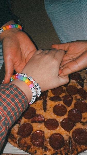 us holding hands in the pizza